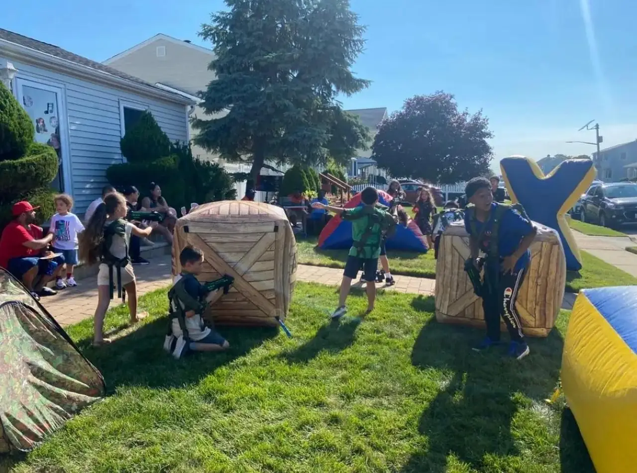 Outdoor laser tag arena set up on a front lawn